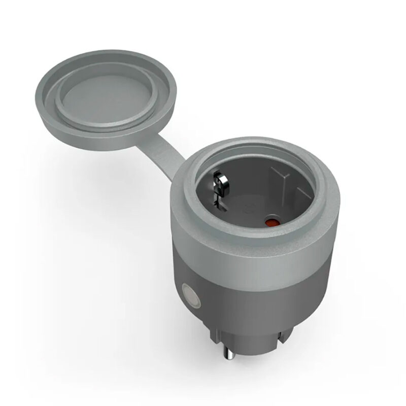 ham600001-1-ad0 Adaptador de enchufe gris con tapa, ideal para carga de dispositivos en tecnología y fotografía.