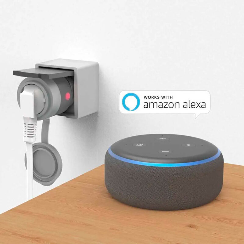 ham600001-4-d4f Altavoz inteligente Amazon Echo Dot en color gris, compatible con Amazon Alexa, ubicado sobre una mesa de madera.