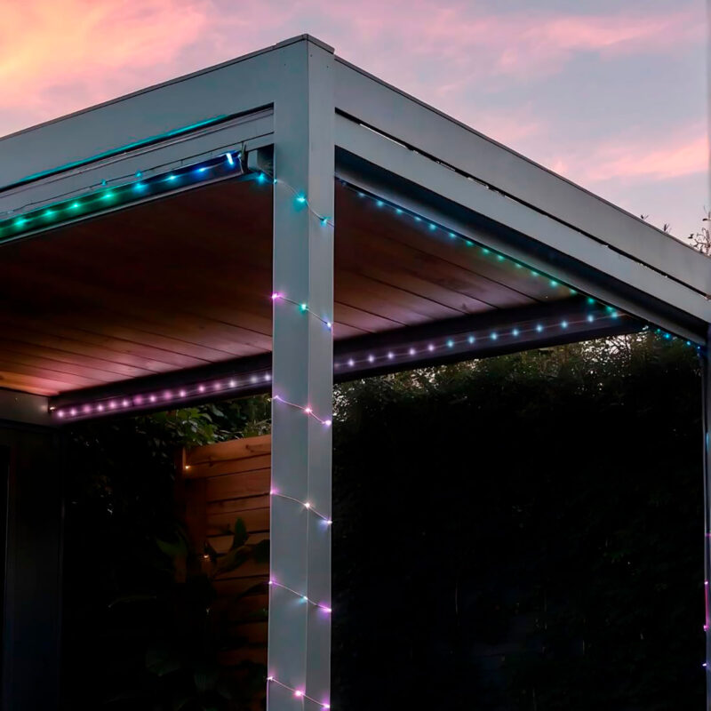 ham600003-5-562 Multicolored LED light strips illuminating a modern pergola, ideal for outdoor decoration.