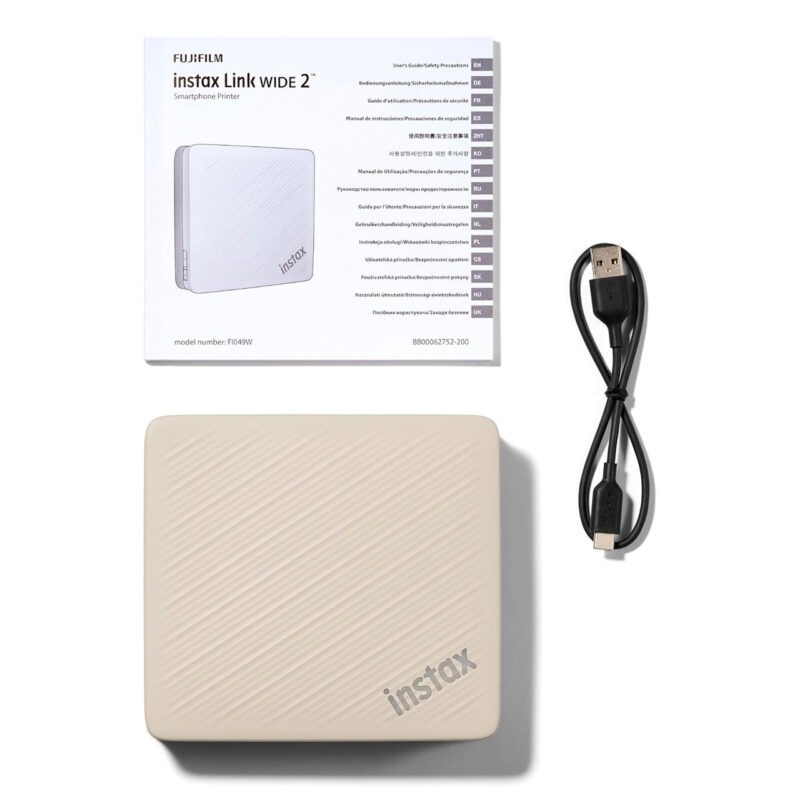 fuj170517-9-29c Impresora portátil Fujifilm Instax Link Wide 2 en color beige con guía de usuario y cable USB. Ideal para fotos instantáneas.