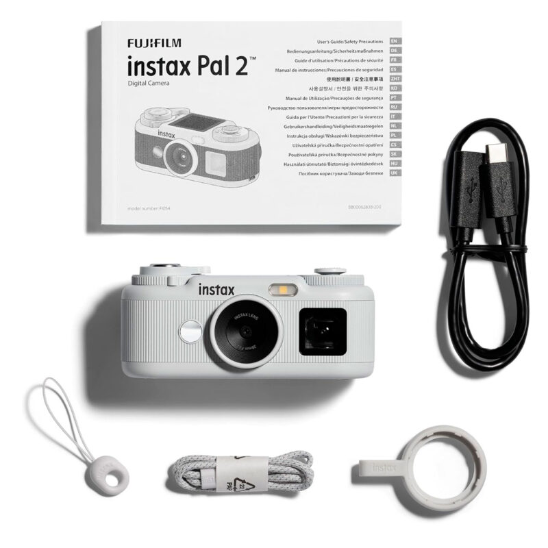 fuj170519-9-eb5 Cámara digital Fujifilm Instax Pal 2 con manual, cable USB y accesorios. Ideal para fotografía instantánea.