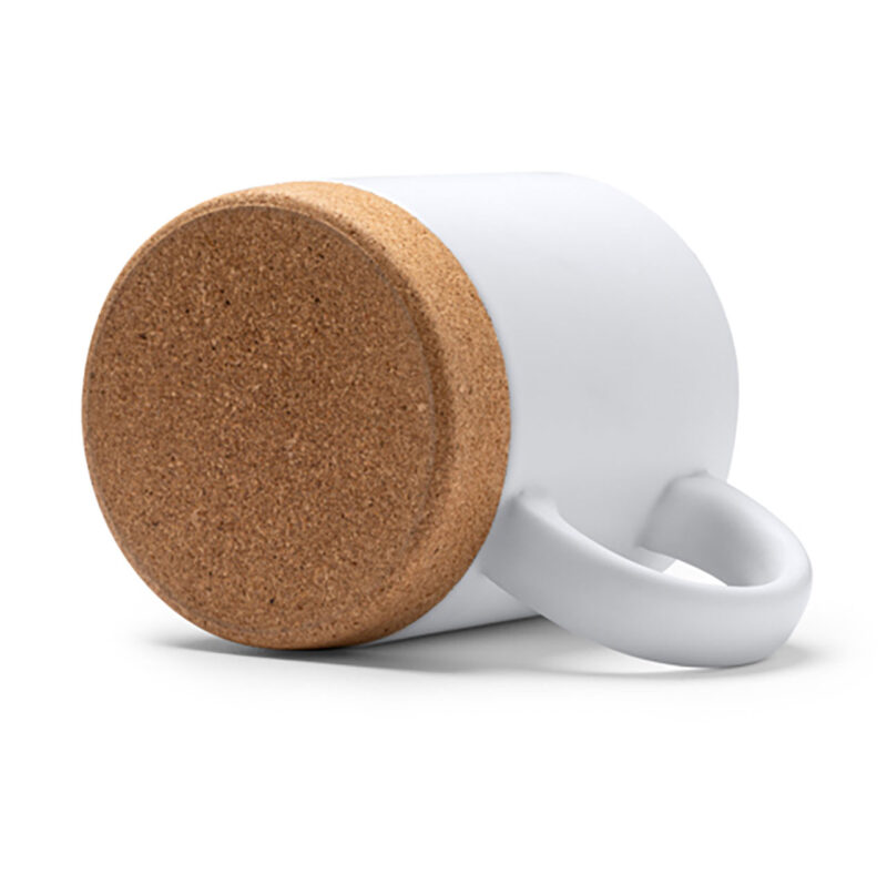 tct712011-2-5f1 Taza blanca con base de corcho, diseño moderno y minimalista, ideal para café y té.